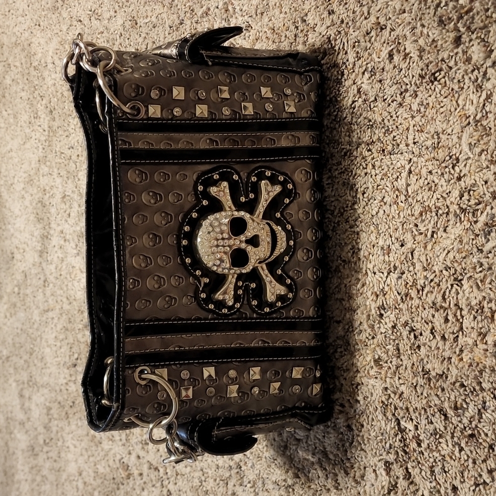 Skull accented purse